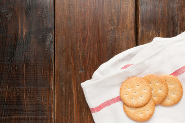 cracker stacked on white fabric over wood table