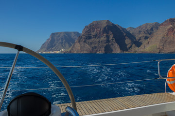 Sailing on luxury yacht in Atlantic ocean near La Gomera Island in Spain. View to Valle Gran Rey
