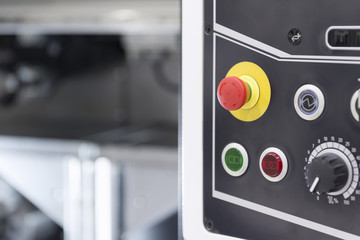 The emergency button or emergency knob of CNC milling machine with the control panel.