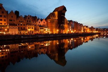 Fototapeta na wymiar City skyline of Gdansk at evening in Poland, Old Town with reflection on Motlawa River