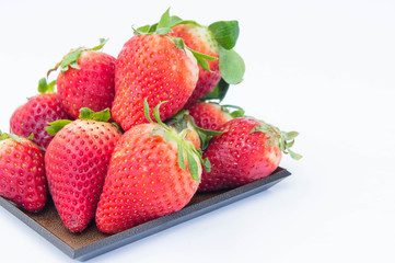 Strawberry on white background fruit's healthful cordial, useful