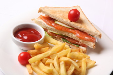 sandwich with french fries and sauce