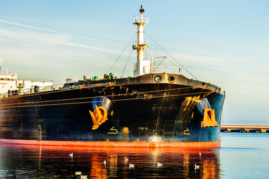 A bow of a tanker ship with anchor.