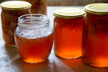Fototapeta na wymiar Glass jars with homemade apple jam