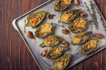 Artichokes baked with cheese, garlic and thyme.