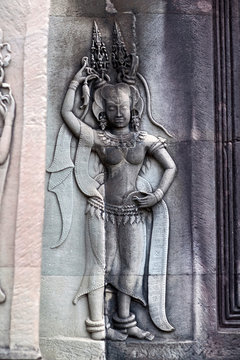 Ancient bas-relief with Apsara in Angkor Wat, Cambodia