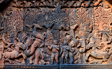 Ancient bas-relief at the facade of Banteay Srey Temple in Angkor Area, Cambodia