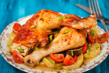 Roasted chicken legs with vegetables