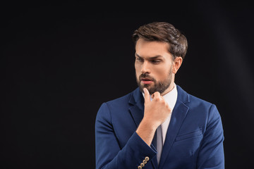 Pensive businessman thinking about something seriously