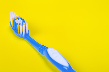 Toothbrush on yellow background