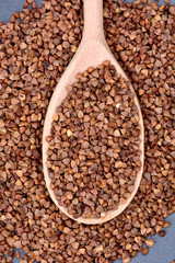 Wooden spoon with buckwheat