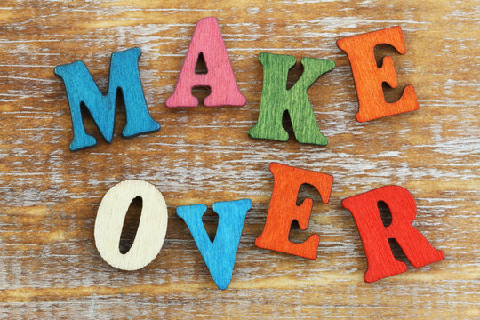 Makeover written with colorful wooden letters on rustic surface
