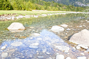 clear water of a river with big stones