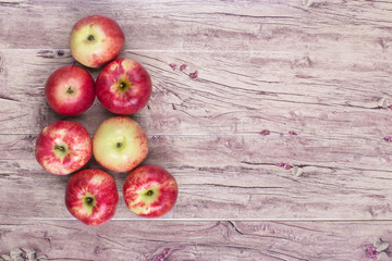 red apples on an old wooden table, Almaty aport