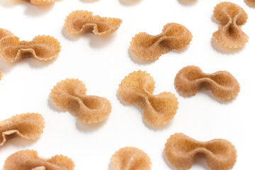 Wholegrain Farfalle Frame. wholemeal. Integral. Close-up photo.