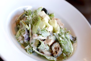 Waldorf salad with lettuce, apple, pickled walnut in a creamy dressing