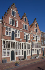 Fototapeta na wymiar Old houses at the waterfront in Hoorn