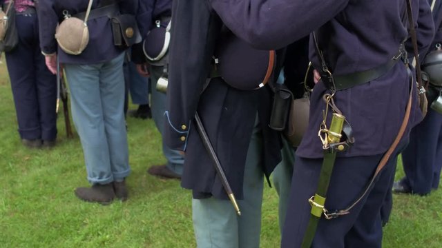 Camera moves by squad of Civil War soldiers