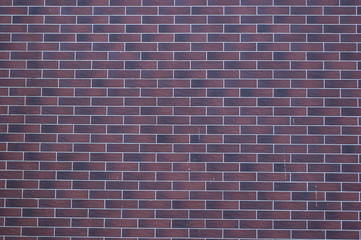 Abstract: A large wall of old red bricks.