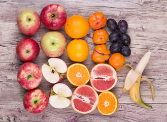 red apples and fruit on a rustic table