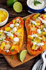 Homemade hawaii Flatbread Pizza with chicken and pineapple dressing yogurt sauce.