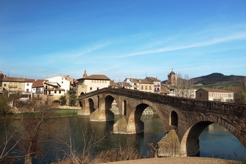 Puente de la Reina's bridge leads the way to Estella village at the beginning of the 5th stage of the Camino de Santiago, Navarra, Spain.