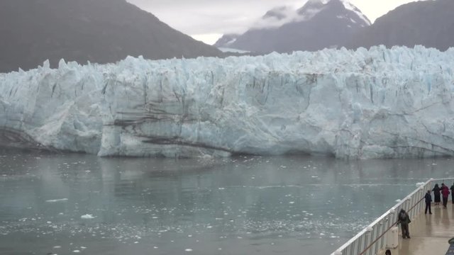 Tourists aboard a cruise ship view Margerie Glacier near Glacier Bay, Alaska.  	