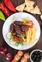 Kofta kebab with french fries nad salad