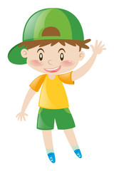 Little boy with green hat waving