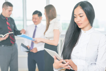 Fototapeta premium Asian business woman using tablet PC. Online banking