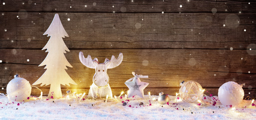 White Christmas Decoration With Lights On Wooden Natural Background
