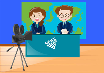 Two news reporters working at the studio