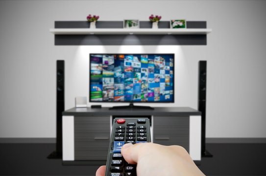 Television broadcast multimedia composition in room and remote control in hand