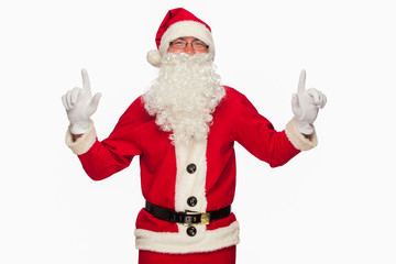 Santa Claus pointing sign with smile, isolated on white backgrou