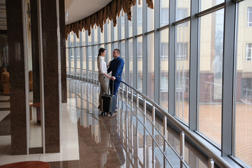 Couple at airport waiting aircraft