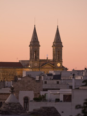 Fototapeta na wymiar twin Tower of church Alberobello