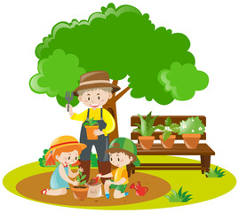 Kids and gardener planting in garden