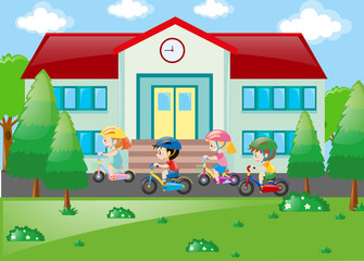 Naklejka premium Students riding bicycle to school