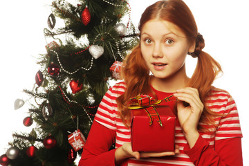 happy woman with gift box and christmas tree