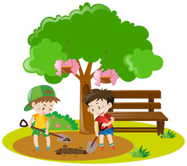 Obraz na płótnie Canvas Two boys digging hole in garden