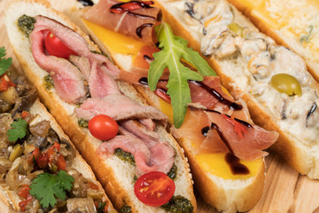 Five sandwiches as background