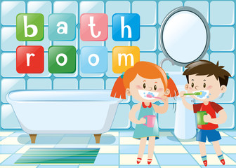 Two kids brushing teeth in bathroom