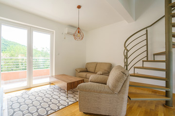 Interior of a living room with spiral staircase