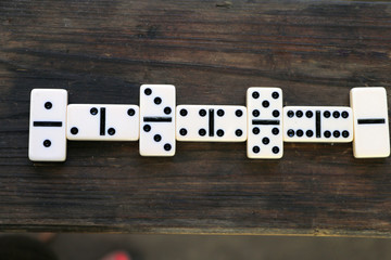 Dominoes scattered on the table, after playing outdoors