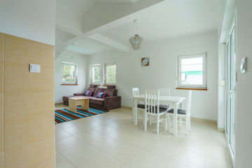 Interior of a living roon with dining zone in an apart-hotel