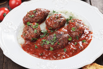 Meatballs with mashed potato and tomato sauce
