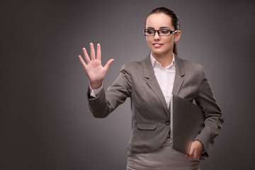 Young businesswoman pressing virtual button