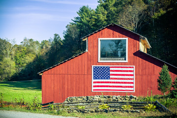 Red barn with American flag © Travis