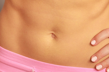 Slim fit female belly, perfect abdomen muscles.