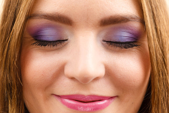 Woman face colorful eye makeup closed eyes closeup